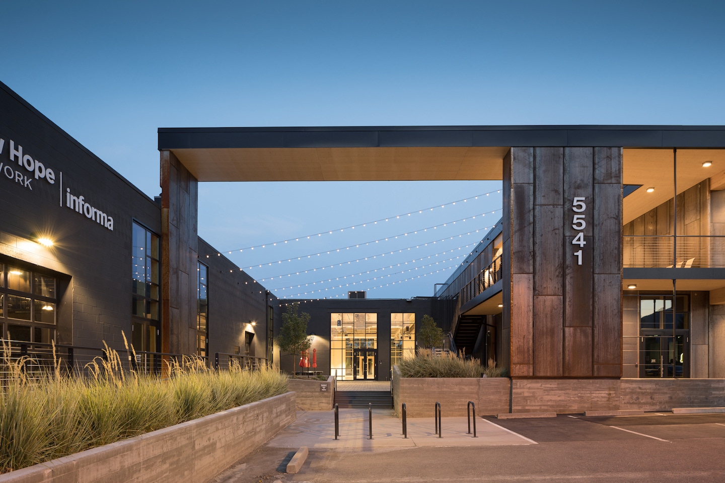 Overhead structure connecting the warehouse space with the two-story CLT office | Photography by JC Buck